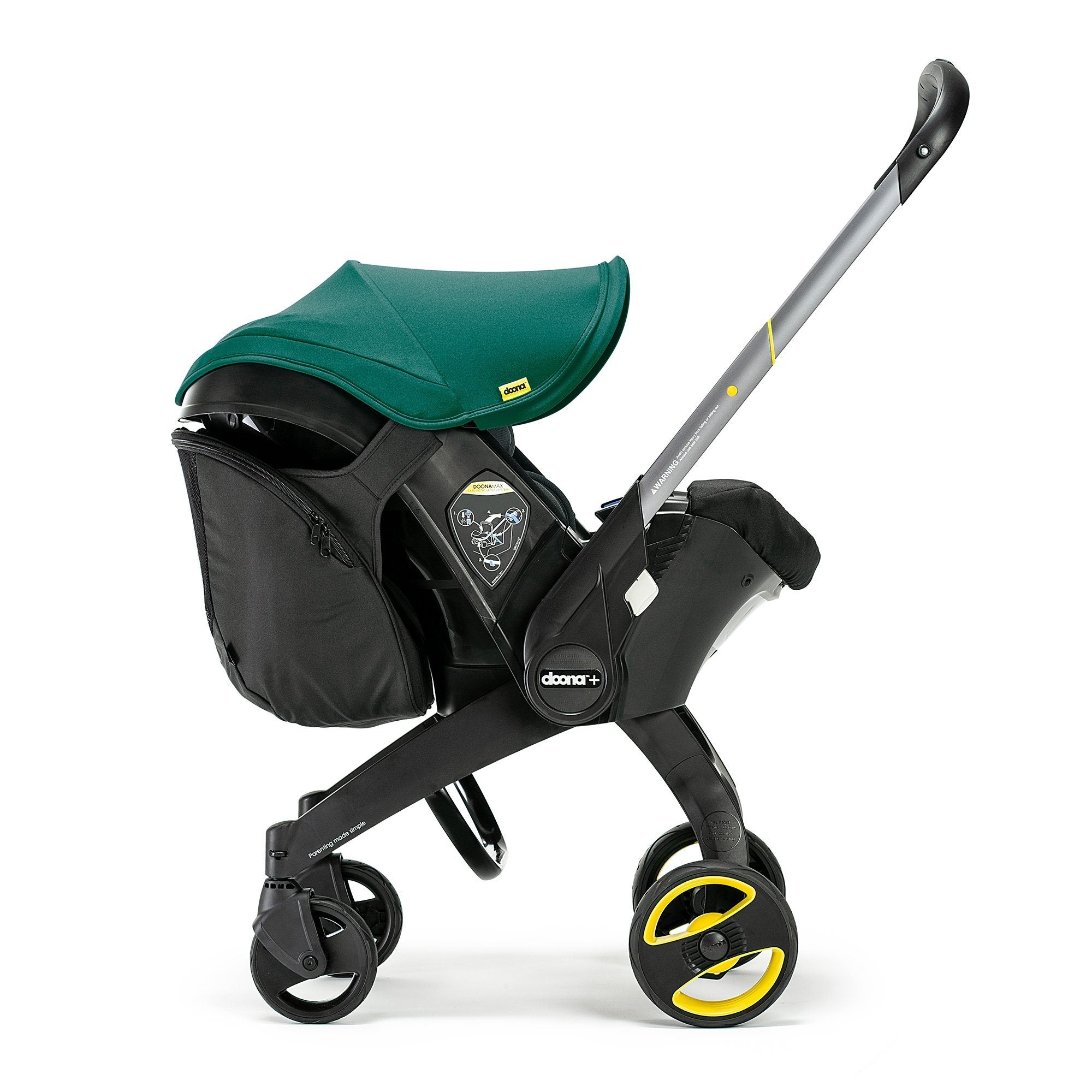 Doona Car Seat Snap-On Storage installed on a green Doona pushchair