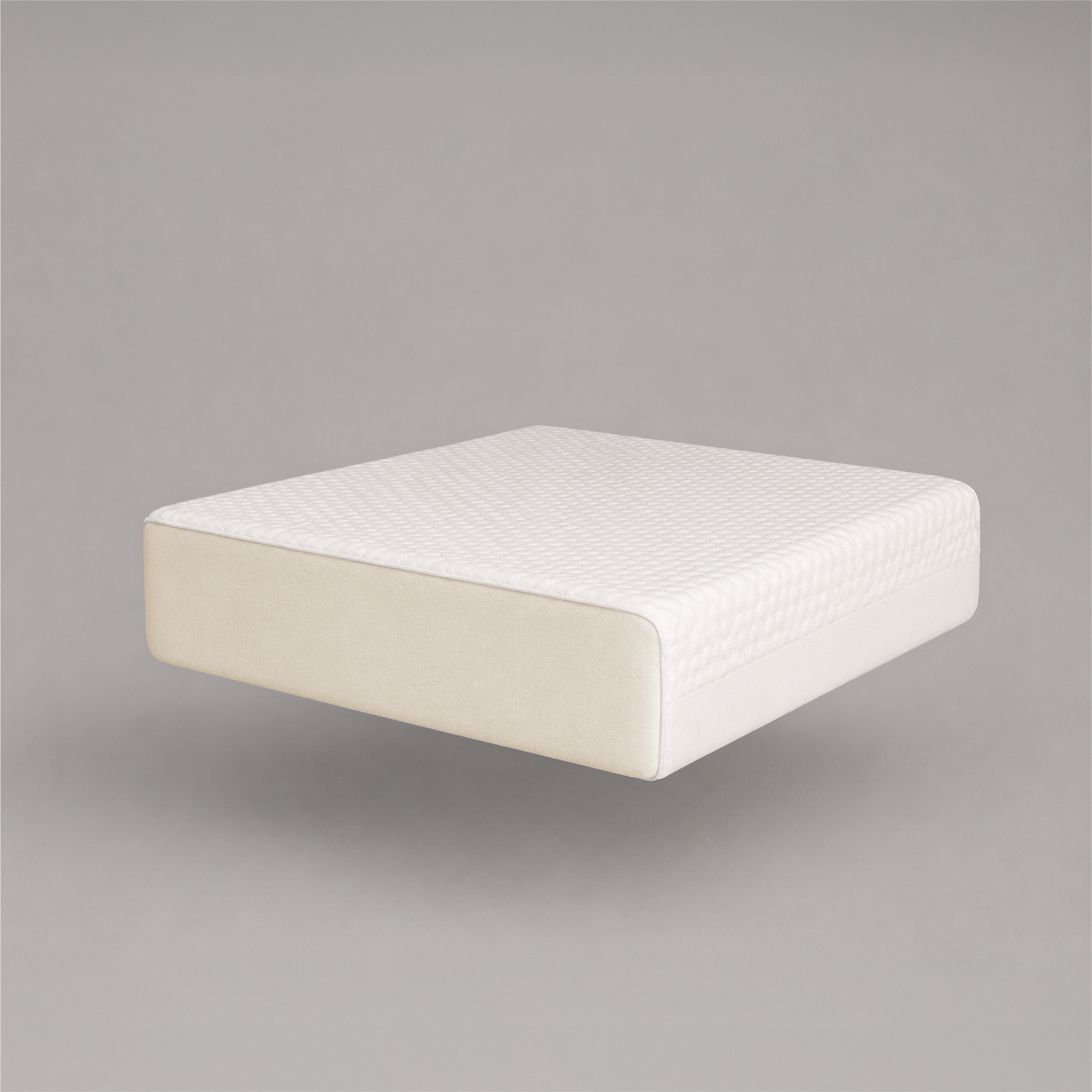 A white mattress topper or mattress slice with a textured top surface and cream-colored side panels, shown floating against a solid gray background.
