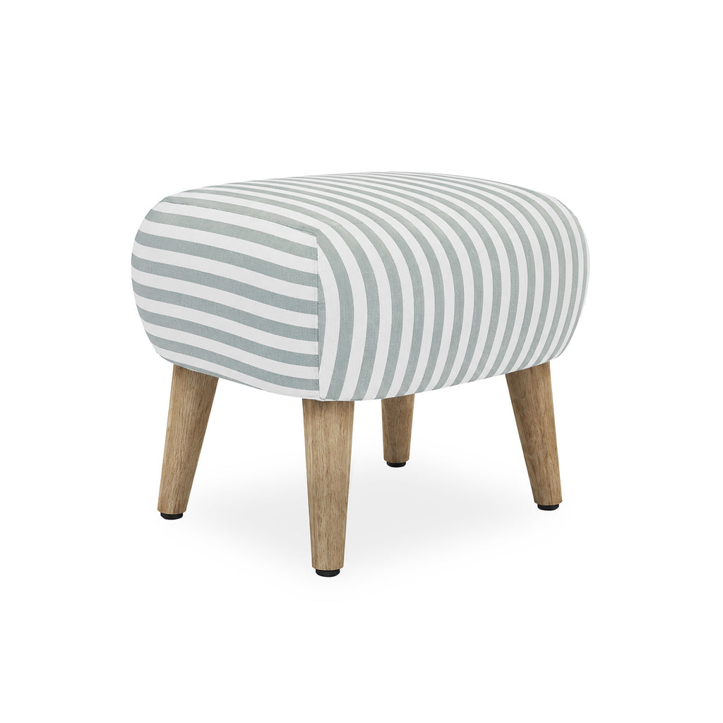 A low, rounded upholstered stool with a white fabric covered in blue vertical stripes, supported by four natural wood legs with black rubber tips, shown on a white background.