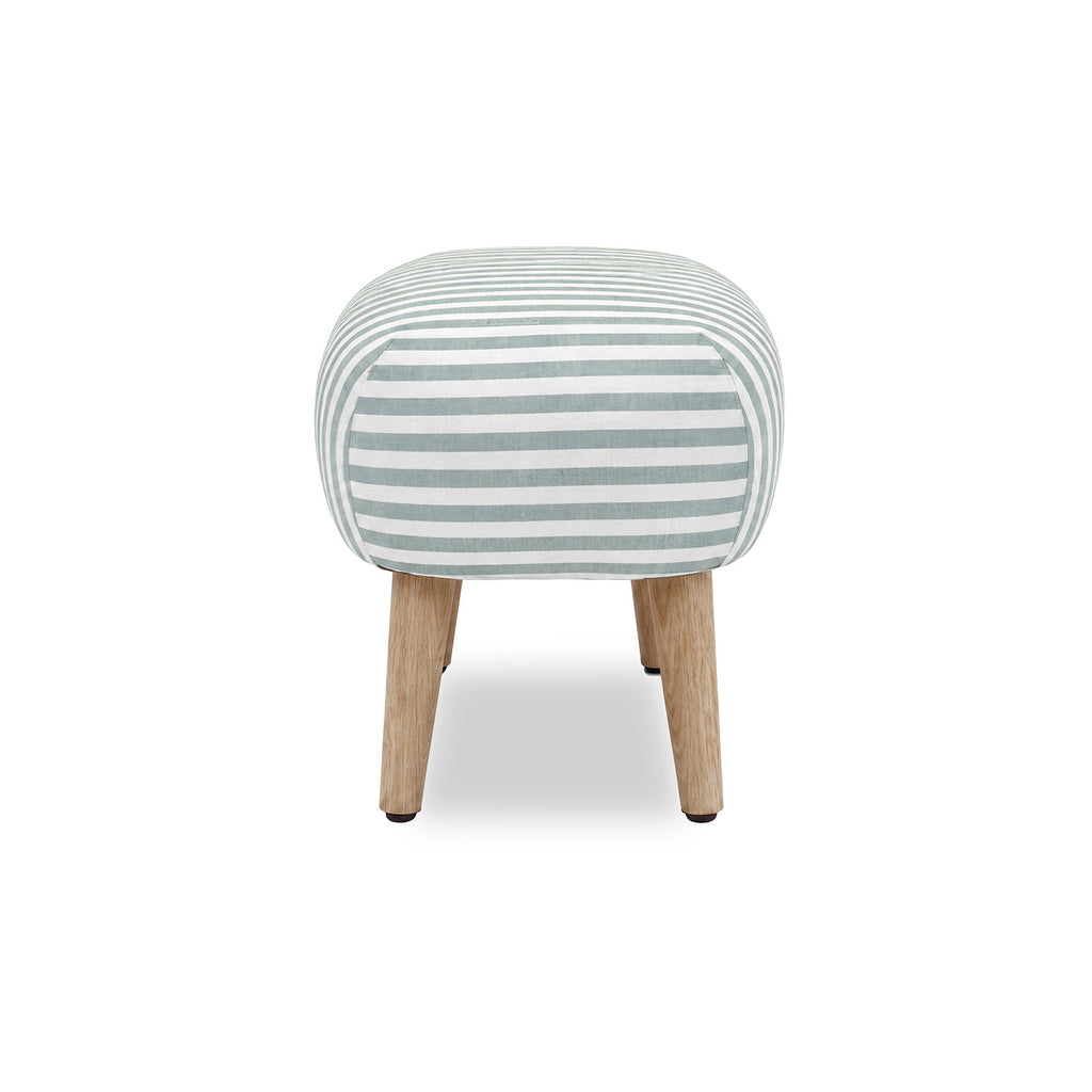 A small upholstered stool with a rounded square cushion covered in blue and white horizontal stripes, supported by four tapered light wood legs on a white background.