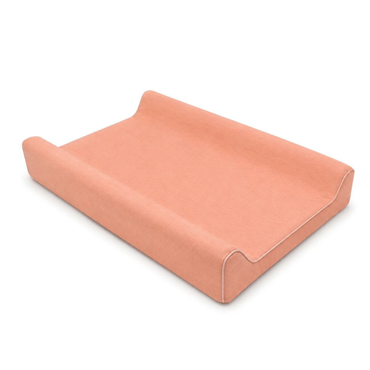 A peach-colored fabric changing pad or cushion with a contoured, tiered design and white contrast stitching, shown on a clean white background.