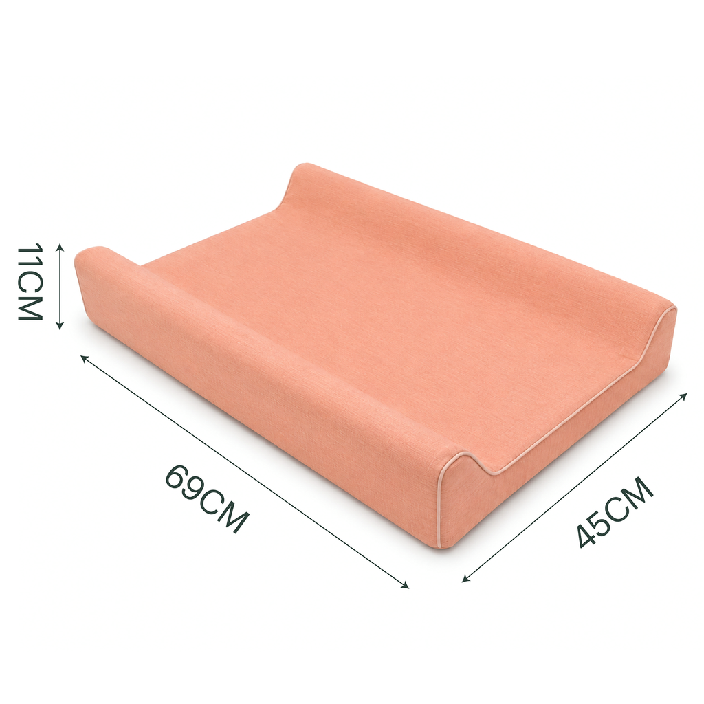 A peach-colored changing pad shown on a white background with dimension lines and labels indicating 69cm length, 45cm width, and 11cm height.