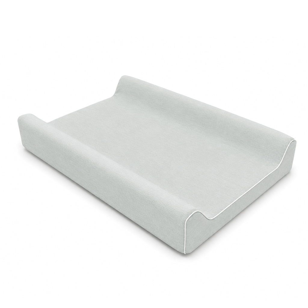 A light blue fabric changing pad with a contoured design, shown on a clean white background.