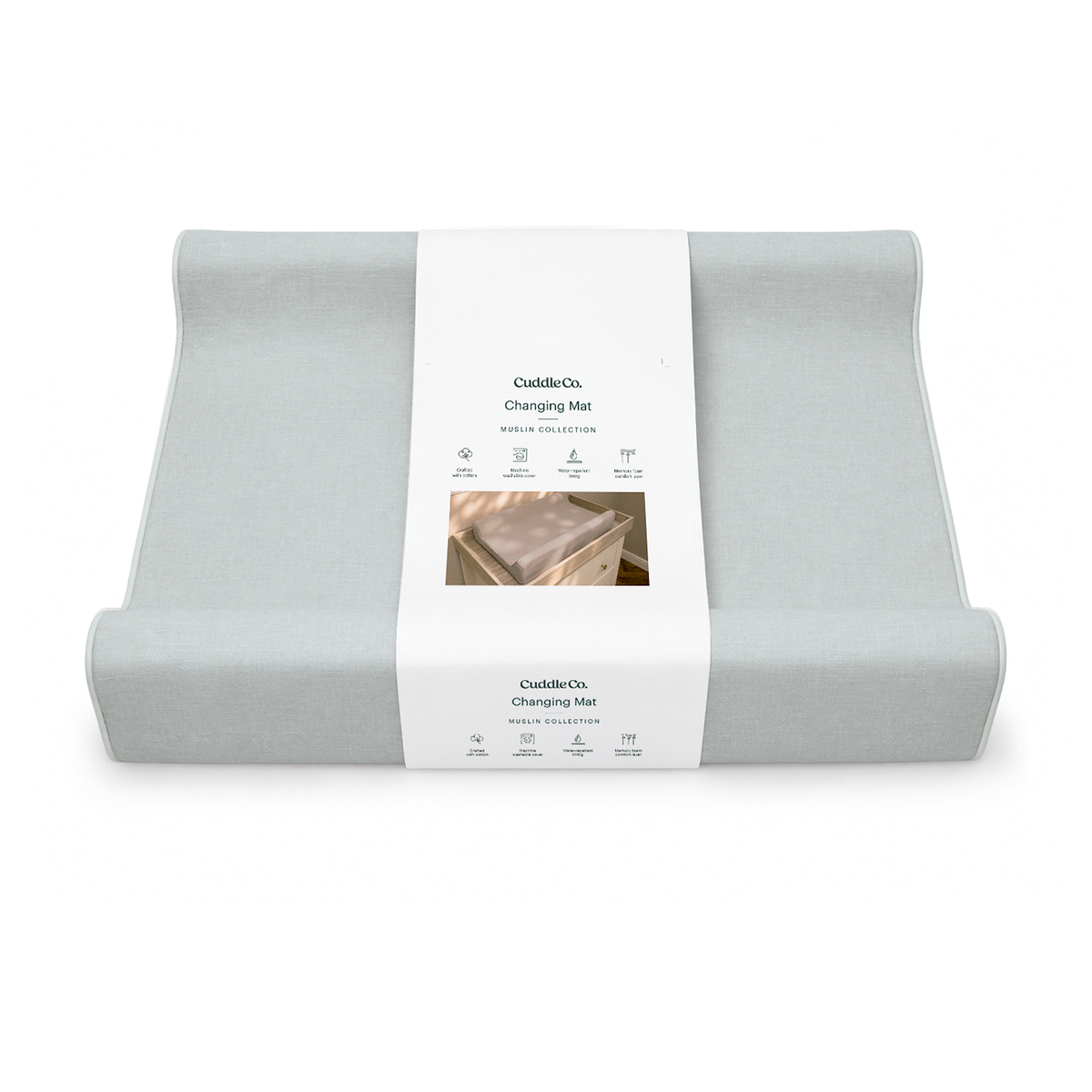 A folded light blue changing mat with a white paper label band in the center, photographed on a clean white background. The label shows the brand name CuddleCo and the product name Changing Mat.
