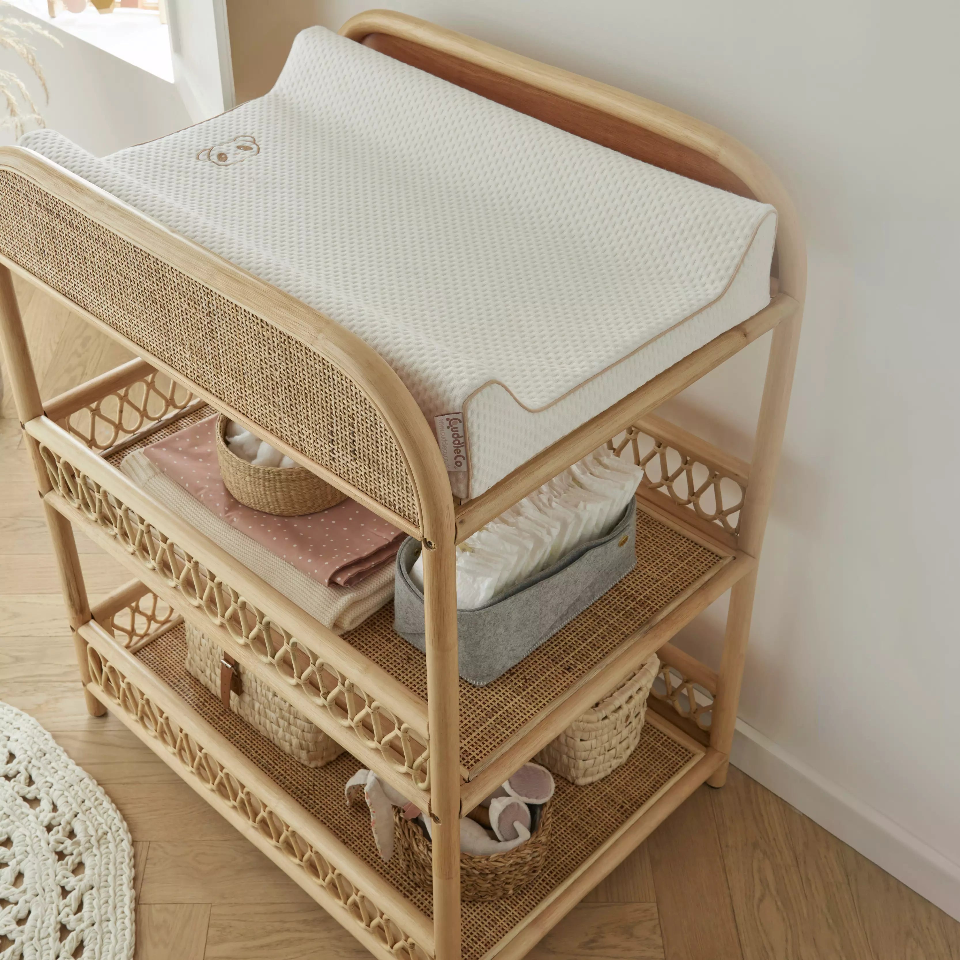 Aria changing table from above with white changing mat CuddleCo 