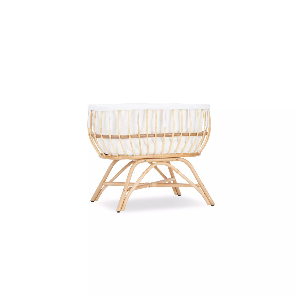 Aria rattan crib with white crib liner inside CuddleCo 