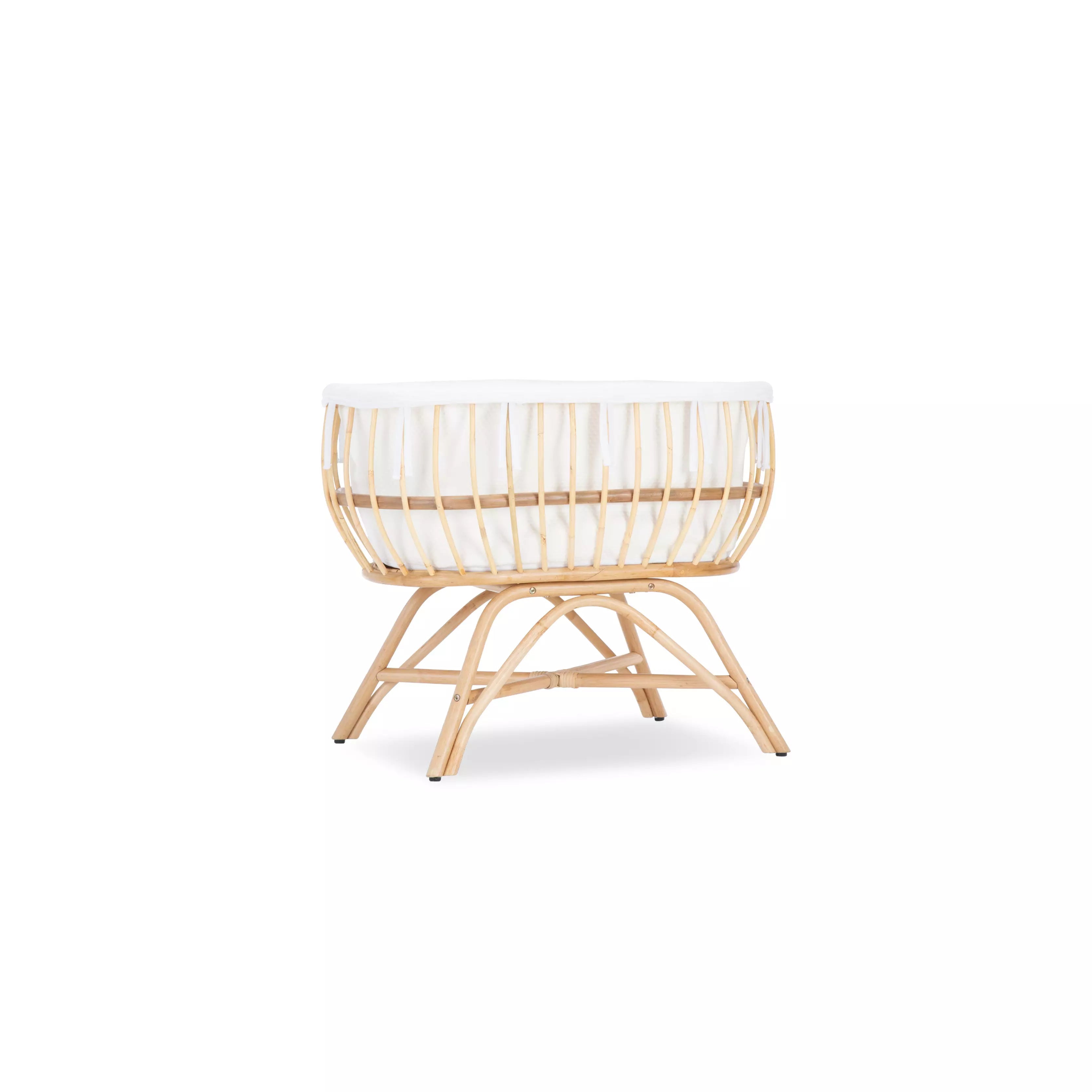 Aria rattan crib with white crib liner inside CuddleCo 