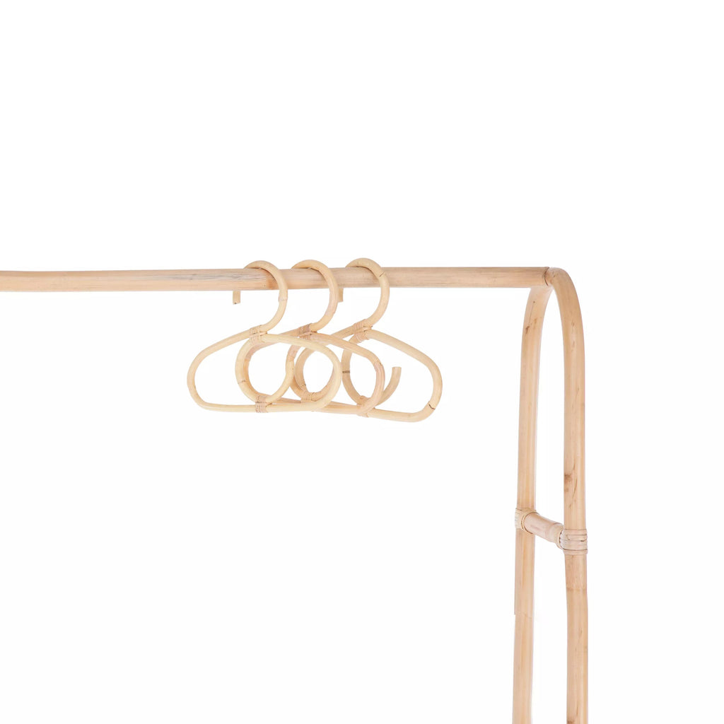 Aria rattan baby clothes hangers hanging on the Aria clothes rail CuddleCo 