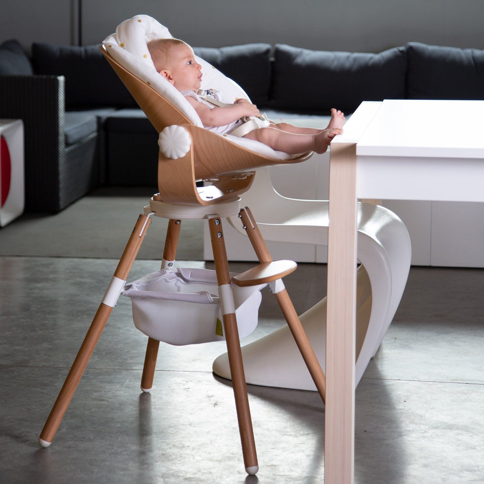 Baby sat in the Evolu Newborn Seat Natural / White by Childhome 